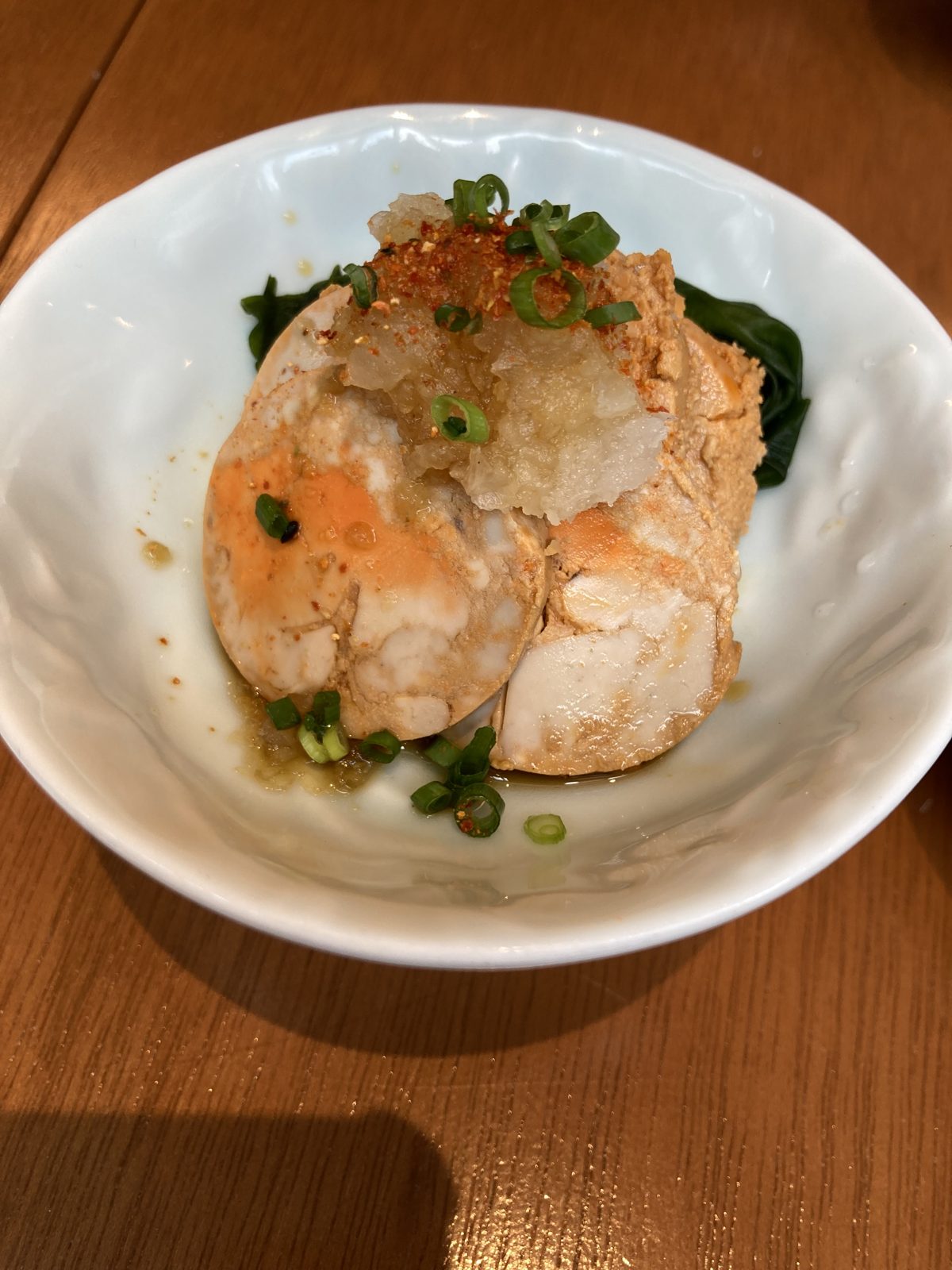 A dish topped with grated daikon radish