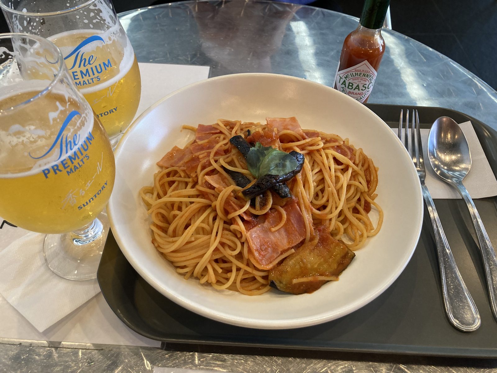 A pasta dish and a glass of beer at Pronto