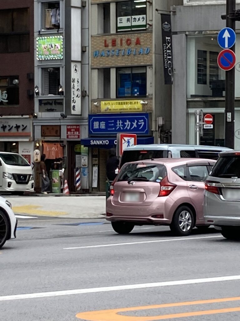 Sankyo Camera seen from across the street in Ginza, with Leica and Hasselblad lettering on the building